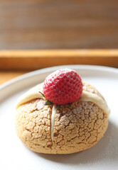 choux cream cake with strawberries on plate
