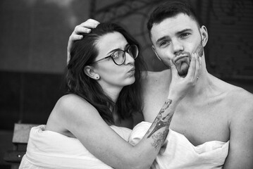 A cheerful couple shares a moment of playful intimacy, full of love and joy.