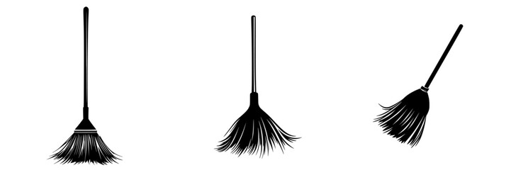 Various styles of black brooms used for sweeping and cleaning in different settings