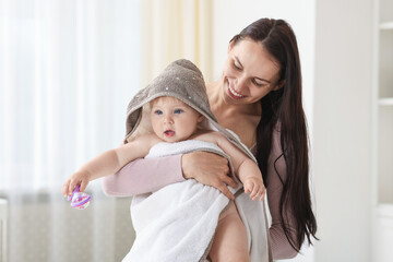 Mother with her cute baby at home