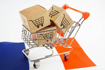 Online shopping, Shopping cart box on France flag, import export, finance commerce.
