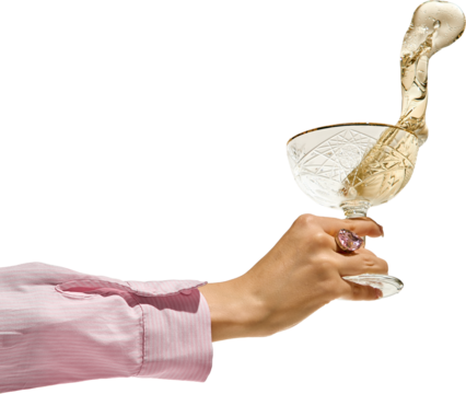 Female hand with ring in pink shirt holding crystal glass of champagne mid-splash, golden drink elegantly flying out. Transparent background. Concept of celebration, elegance, spontaneity.