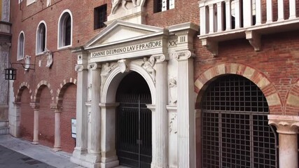 Entrance and winged lion emblem on Palazzo del Podestà in Piazza dei Signori - Powered by Adobe