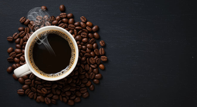 Roasted coffee beans spilling from a white mug onto a dark saucer, ready for a fresh morning brew