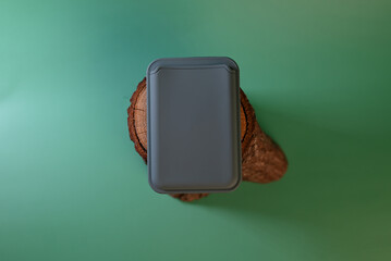 cardholder with magnet on green background