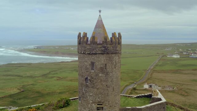 Aerial orbit of Doonagore Castle. 16th-century tower house. Doolin, Ireland