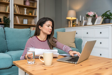 Young strong independent freelance businesswoman, small startup business company owner, sitting at...