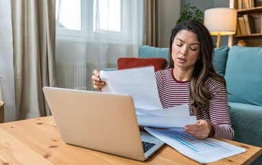 Young strong independent freelance businesswoman, small startup business company owner, sitting at...