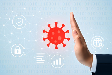 Virus protection and security concept with hand stopping virus and digital security icons around it
