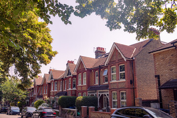 Typical street of British red brick terraced houses in west London