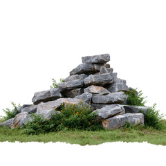 A pile of natural stones surrounded by greenery, showcasing the beauty of nature. Perfect for enhancing outdoor or garden scenes with a rustic touch.