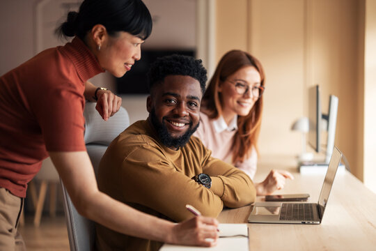 Multiracial Team Collaborating at Work in a Modern Office Setting