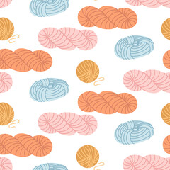 bright flat pattern depicting balls of yarn in various shades of blue, pink, orange, and yellow on white background. Theme knitting. Perfect for decorating textiles or handicrafts. Packaging branding