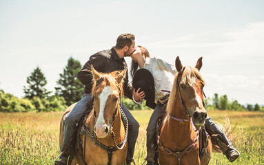 couple boyboy and girl, stands next to her horse in summer season