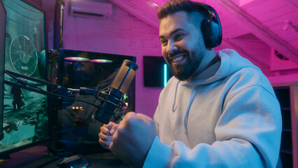 Excited winner champion Caucasian guy male gamer streamer man winning luck achievement victory...