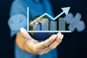 A human holds a glowing Earth globe, symbolizing global business and interconnectedness, overlaid with a dynamic upward-trending financial graph, a percentage sign, and a digital coin