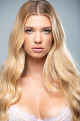 Fototapeta premium White lingerie photo set of beautiful blonde woman in clean studio light, showing front and side views. Perfect for underwear catalog, fashion e-commerce, and online advertising.