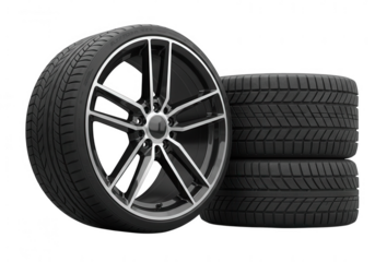 High performance alloy wheel and stacked tires isolated on transparent background