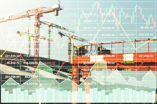 Stock financial index data on construction industry presentation background with graph, chart and candlesticks data diagram with working tower cranes on construction site.
