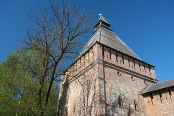 Fototapeta premium red brick tower against blue sky, Smolensk