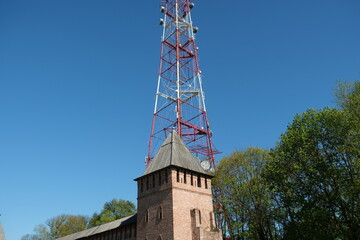 red brick tower and television tower behind it, Smolensk