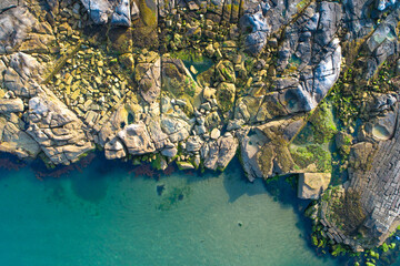 Obraz premium Wild Nature Landscape of a Cliff and the Ocean from Above, aerial drone top down view zenithal