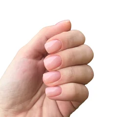 Wanddecoratie Nagelstudio Beautiful nude manicure with light beige nail polish close up isolated on white background  © Stanislava