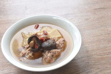 boiled cabbage stuffed mashed pork with glass noodles topping mushroom n soup on bowl