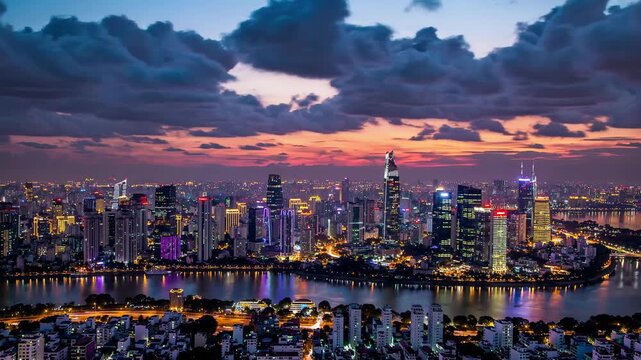 Vibrant urban landscape of Ho Chi Minh City, revealing glowing city lights reflecting on Saigon River during dramatic evening sunset