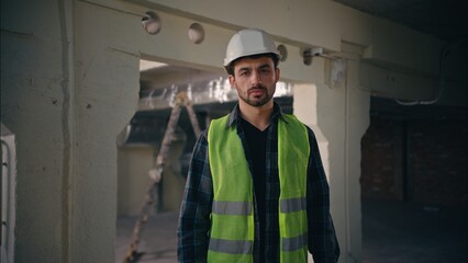 Serious dissatisfied Caucasian man showing hand gesture stop deny no build male guy builder reject...
