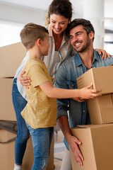 New home. Parents with child moving in new house, property mortgage and real estate investment.