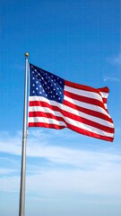 Fototapeta premium American flag waving in a clear blue sky (8)