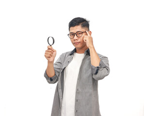 Young Man with Magnifying Glass Contemplating Ideas and Discovering Insights on White Background