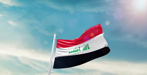 Iraq national flag waving with beautiful sky.