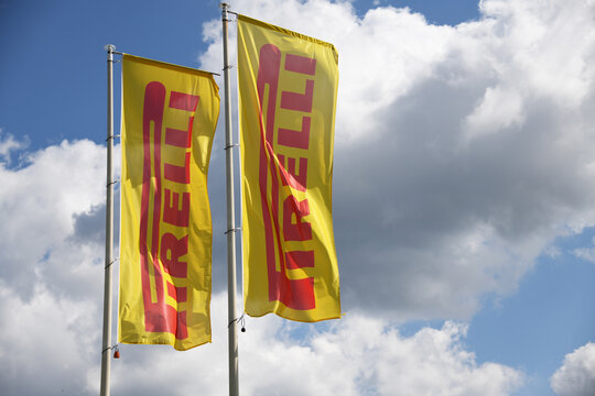 Alfdorf, Bade W&uuml;rttemberg, Germany - July 4, 2025: Flags with the logo of the tire manufacturer PIRELLI in Alfdorf, Germany -  Pirelli is an Italian multinational company based in Milan, Italy