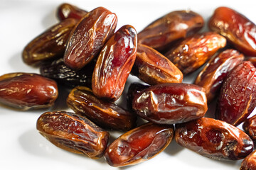 Close-up view of a pile of delicious, plump, and sweet dates, ready to eat.