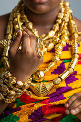 Rich Ghanaian royalty regalia. Traditional African culture and heritage, gold ring jewellery,...