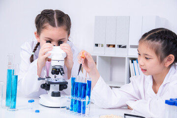 Learning and education for students in classroom, instruction by teacher, children participate in...