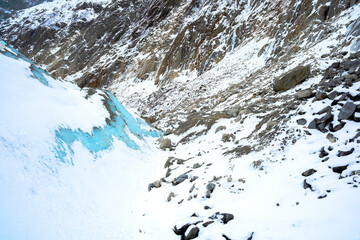 Frozen icy blue surface with snow detail from Chamonix for winter, arctic and nature abstract concepts