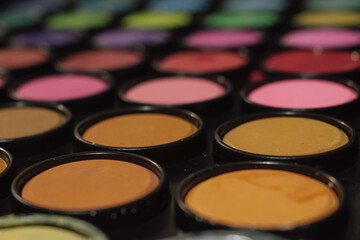 A palette with water-soluble paints for drawing. Abstract background. Back to school