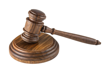 Wooden judge gavel resting on tiered sound block justice legal