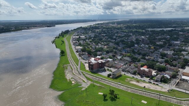 New Orleans, Louisiana urban neighborhood on the banks of the Mississippi River with Levees earthen embankments to control flooding from the river is also walking biking trail