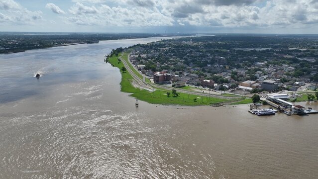 New Orleans, Louisiana urban neighborhood on the banks of the Mississippi River with Levees earthen embankments to control flooding from the river is also walking biking trail