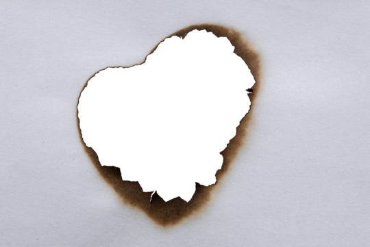 burn paper sheet burnt edges and hole.burnt effect with flame and ash. Torn and scorched paper texture,hole in burn paper,Burnt paper holes