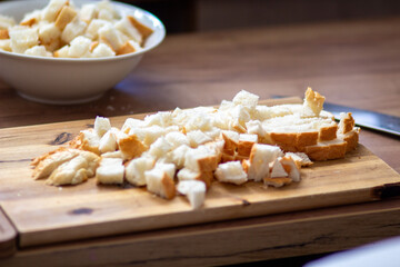 Chopped Bread Cubes on Wooden Cutting Board