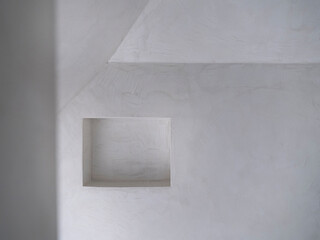Bathroom built-in storage niche detail with clean white finish and minimalist architectural design