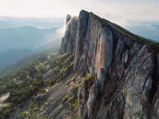 Bolshoy Tkhach mountain in Caucasus with pre sunset or sunrise light, wall of tall rocks