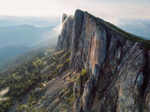 Bolshoy Tkhach mountain in Caucasus with pre sunset or sunrise light, wall of tall rocks
