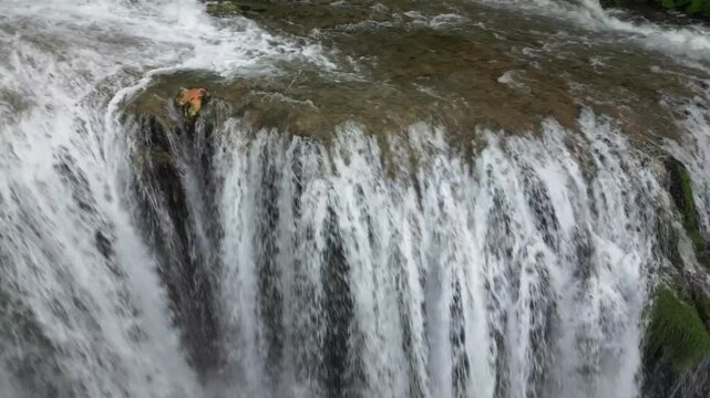 The spectacular waterfall at Marmore Falls, seen from a drone: the melted water from the glacier begins its journey toward the sea after the spring thaw.  drought aridity 