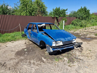 Old broken rusty passenger car